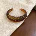 Amber brown resin cuff bracelet with spiral twisted texture in chunky geometric style - Style 25