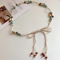 Handmade bohemian braided rope belt with colorful acrylic beads on white background - White