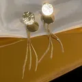 Eleganti orecchini lunghi con nappe dorate catena a serpente e dischi metallici. - Nappina di Paillettes Oro (9#)