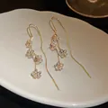 Detailed view of elegant real gold plated zircon flower tassel drop earrings for women. - Floral Tassel Ear Line (HE8310) / Gold