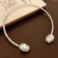 Detailed macro view of a vintage silver choker necklace with large irregular pearls - Choker Necklace / Silver