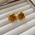 Detailed view of vintage geometric stud earrings with golden frames and amber-colored resin centers - Triangle (6#) / Silver Needle / Gold/Brown