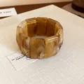 Close-up detail of vintage amber marbled resin rectangular blocks on a stretch bracelet - Light Coffee (22#)