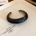Minimalist smoky brown translucent oval open bangle featuring a diagonal textured pattern - Black (#2)