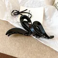 Elegant minimalist black wavy hair claw clip with glossy finish for fashionable hair styling - 23# Wavy Cross Style
