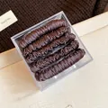 Set of 5 brown fabric elastic spring hair ties neatly packed in a clear storage box - Five-Piece Set / Dark Coffee