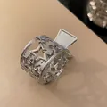 Detailed close-up view of a silver metal hair claw clip with hollow star patterns - Star Style (17#)