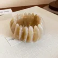 Minimalist stretch bangle bracelet with marbled elliptical segments in a cream finish - Light Coffee (46#)