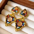Close-up of vintage royal style geometric drop earrings with colorful rhinestones - Geometric Heart Drop / Colorful