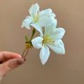 Detailed view of white fabric flower hair fork with dewdrop accents and gold pin - Simulated Water Drop Hairpin / Green