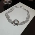 Modern multi-strand silver necklace featuring a large polished metal ball pendant - 34# Silver-Tone Multi-Layer Necklace