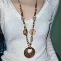 Close-up of a Bohemian ethnic beaded necklace with leopard print pendant worn by a model - 12# Style - Leopard Print Round Ring