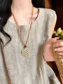 Close-up detail of a Bohemian woven flower necklace paired with minimalist linen clothing - 13# Style - Woven Flower