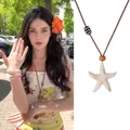 Detail showing bohemian starfish necklace with wooden beads and brown woven cord - 29# Style - Starfish Beaded