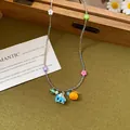 French retro beaded necklace with colorful elephant and floral charms on a green background - Colorful Flower Elephant Style / 12# Necklace Multicolor
