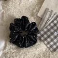 Close-up of black satin scrunchie with white polka dots showing soft fabric texture - White Polka Dot Style (2#)