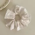 Close-up of a white fabric scrunchie with blue polka dots and delicate lace trim detail - Blue Polka Dot Lace Style (8#)