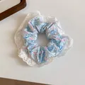 Detailed view of floral scrunchie with delicate white lace trim and blue floral print. - Blue Pink Floral Lace Style (11#)