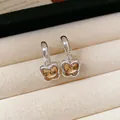 Elegante versilberte Schmetterlingsohrringe mit funkelndem Champagner-Kristall - Schmetterlings-Anhänger-Stil (84#)
