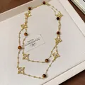 Elegant double-layer long necklace featuring tiger's eye beads and ornate gold cross pendants - Gold Brown