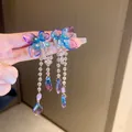 Close-up of blue and purple gradient butterfly tassel earrings with crystal beads - Blue Petal (14#)