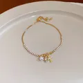 Elegante bracciale placcato oro con zirconi, perla e ciondolo a forma di croce. - Braccialetto a stella a croce con perla artificiale (91#) / Oro