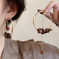 Exquisite New Chinese retro hoop earrings with wooden beads and long chain tassel detail - Silver Earring Post Style / Gold Brown