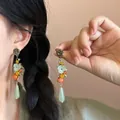 Retro New Chinese style tassel earrings with green glass beads and floral metal accents - Silver Earring Post Style / Antique Gold-Green