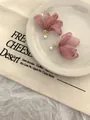Elegant pink chiffon flower earrings with white pearl accents on ceramic plate background - Clip-on (12#)