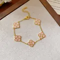 Elegant vintage gold chain bracelet featuring five pink clover charms with crystal accents - Four-leaf Clover Style (43#) / Gold/Pink