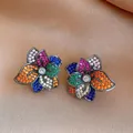 Detailed shot of exquisite multi-colored zircon flower earrings on satin background - 6# Multicolor Six-Petal Flower (Silver Post)