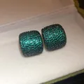 Macro detail view of square stud earrings encrusted with vibrant green zircon stones. - 9# Emerald Green Square (Silver Post)