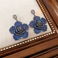Detail macro view of vintage flower stud earrings with blue and clear zircon stones - 15# Blue Spiral Flower (Silver Post)
