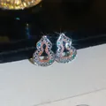 Detailed macro view of sparkling hulu shaped silver earrings set with colorful zircons - 24# Silver Hollow Gourd (Silver Post)