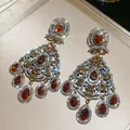 Detailed macro view of vintage amber zircon chandelier earrings with starburst glow - 31# Silver Amber Flower Tassel (Silver Post)