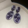 Close-up of vintage-style zircon earrings with purple and white floral patterns. - 44# Purple Flower Double Oval (Silver Post)