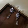 Elegant silver needle earrings featuring pear-shaped zircons and geometric tassel design - Silver Post Hollow Teardrop (13#) / Silver