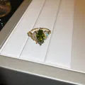 Elegant French gold ring with marquise-cut olive green zircon and shimmering side stones - Marquise Green Gemstone Open Ring (HR2471)