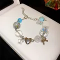 Handmade dopamine colorful beaded bracelet featuring heart, star, and bow metal charms - Blue Ceramic Heart Star Pendant (32 Bracelet)