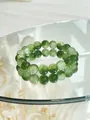 Elegant green and white marbled ceramic beaded bracelet with mirror reflection display - Green White Crystal Beads (37 Bracelet)