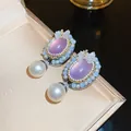 Boucles d'oreilles vintage élégantes avec pierres ovales mauves, perles et détails papillon - Style Pierre Principale Goutte d'Eau (5#)