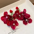 Exaggerated red fabric flower earrings with pearls and elegant green beaded tassels - Green Tassel Style / Rose Red