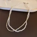 Elegant double-layer necklace featuring white pearls and faceted geometric silver beads. - 16# Double Layer Wrap Pearl and Metal