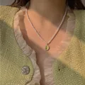 Elegante collana girocollo di perle barocche con ciondolo vintage in pietra verde per donna. - Collana Ovale in Perla Barocca (33.#)