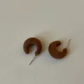 Close-up detail of brown flocked C-shaped stud earrings with a soft fuzzy texture - C-Shape Flocked Style / Brown