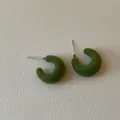 Macro view of green flocked C-shaped stud earrings showing rich velvet texture - C-Shape Flocked Style / Green