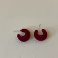 Macro view of dark red velvet flocked C-shaped stud earrings with silver needles - C-Shape Flocked Style / Red