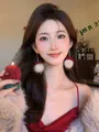 Detail shot of Christmas plush ball earrings and bow necklace worn by an Asian model - Long Style (Earrings And Necklace) / Gold
