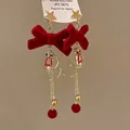 Elegant festive red velvet bow earrings featuring gold stars and plush ball drops - Bowknot Tassel Earrings (16银针)