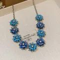 Vintage blue flower necklace with crystal center, elegant light luxury jewelry detail. - Necklace